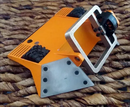 Blockhead, a 150 g wedge robot with a lifting arm